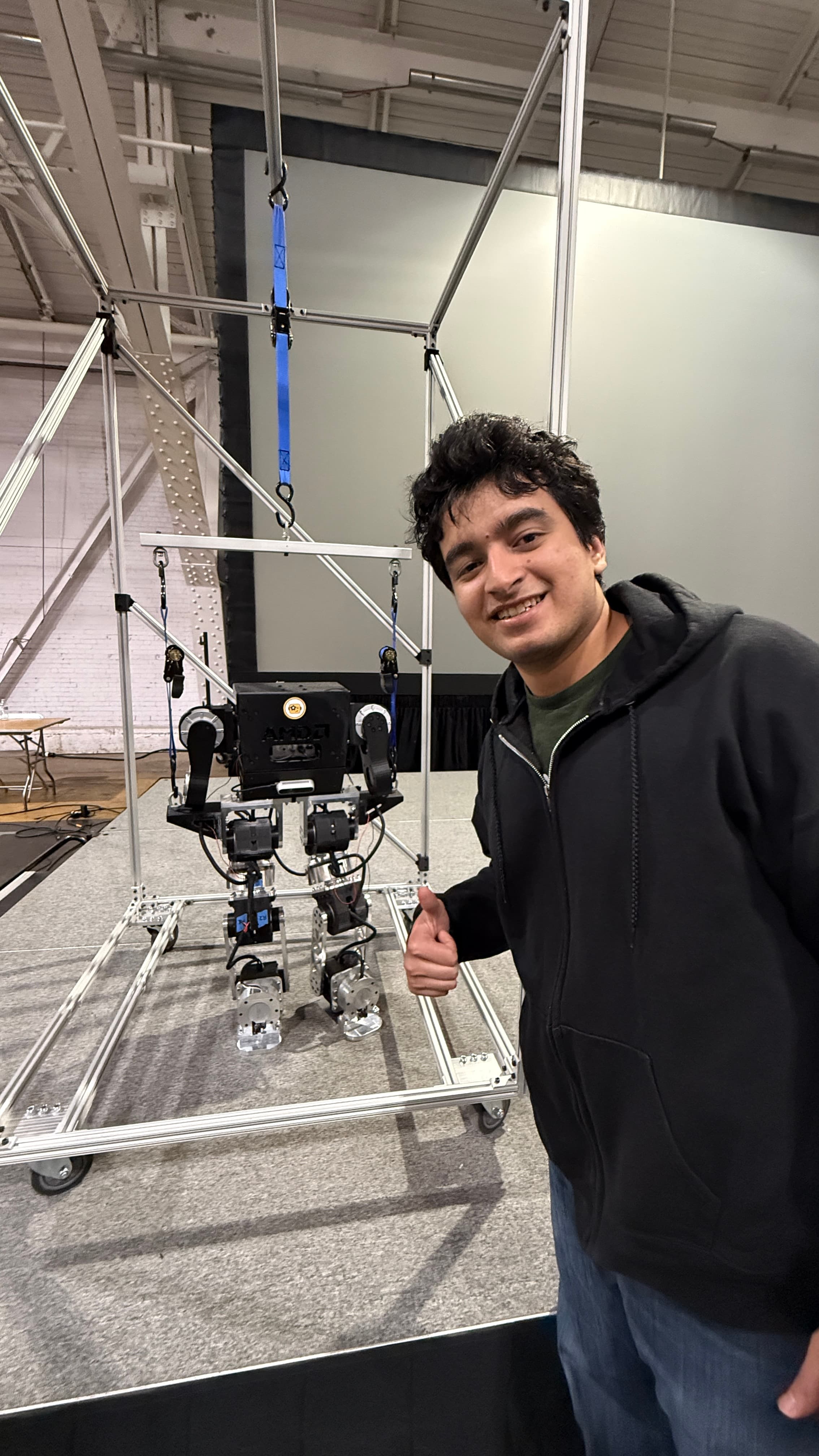 Pranav Kumar with a humanoid robot demo